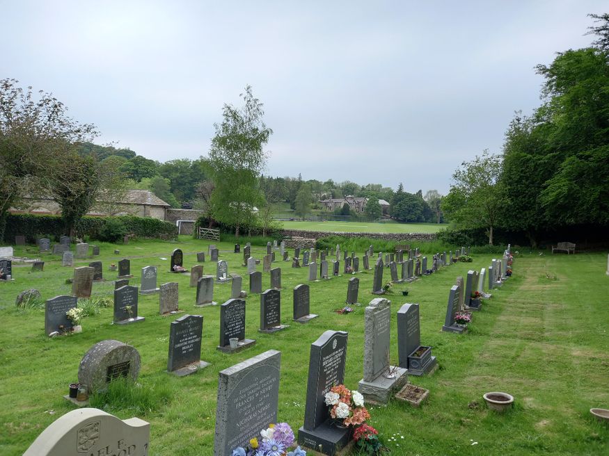 Giggleswick cemetery with Giggleswick school in the distance.