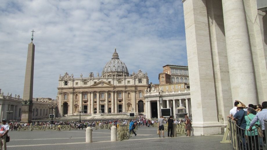 The Pope's balcony is first floor in the centre. On the right is part of the queue for the security scanners