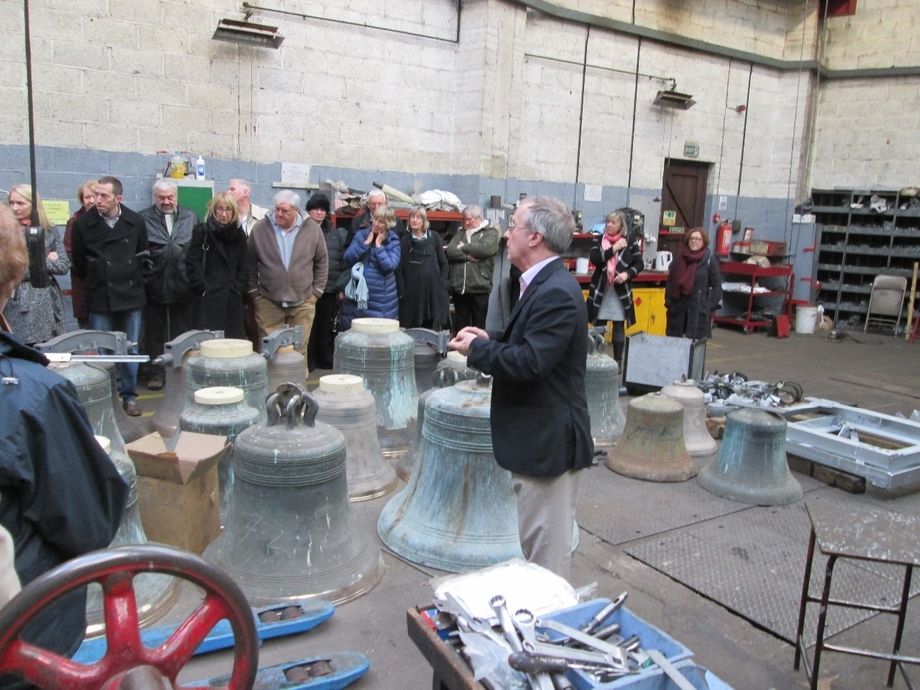 Touring the shop floor of the Whitechapel Bell Foundry amidst bells which have come in for repair.