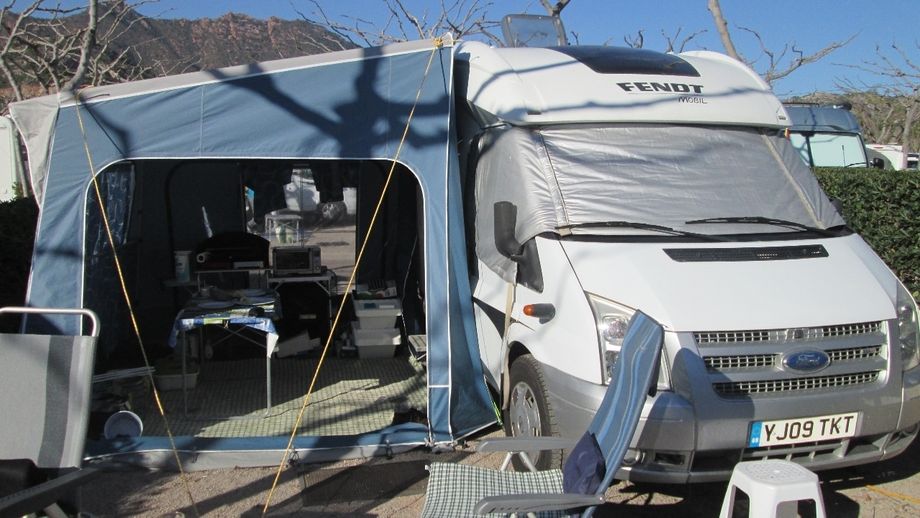 The motorhome relocated right next to the awning