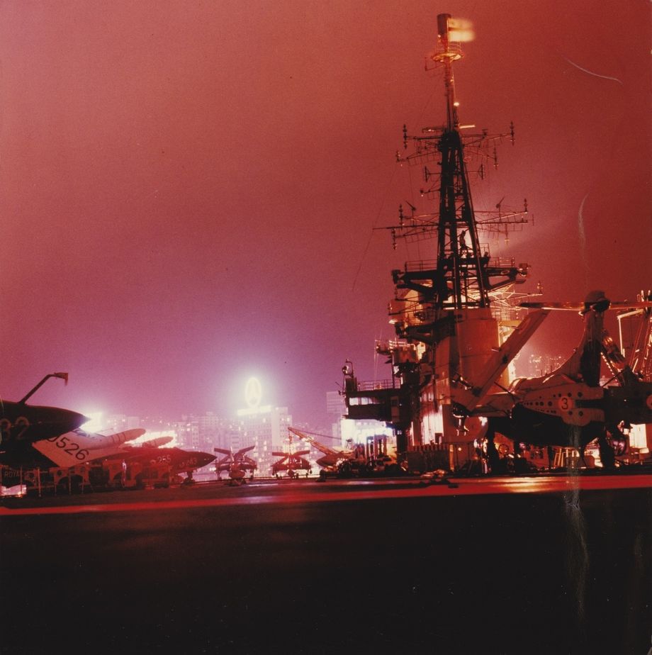 The flight deck at night. HMS Hermes in Hong Kong harbour late 1968